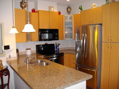 Private enclosed 2 car Garage, comes with 2 Bedrm Condo!