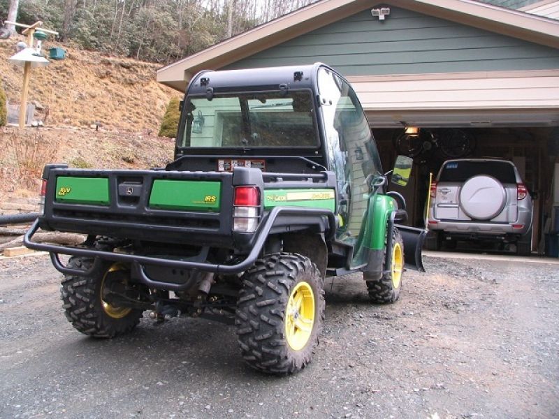 = $4,250 = 2011 John Deere Gator 825i w/ Plow